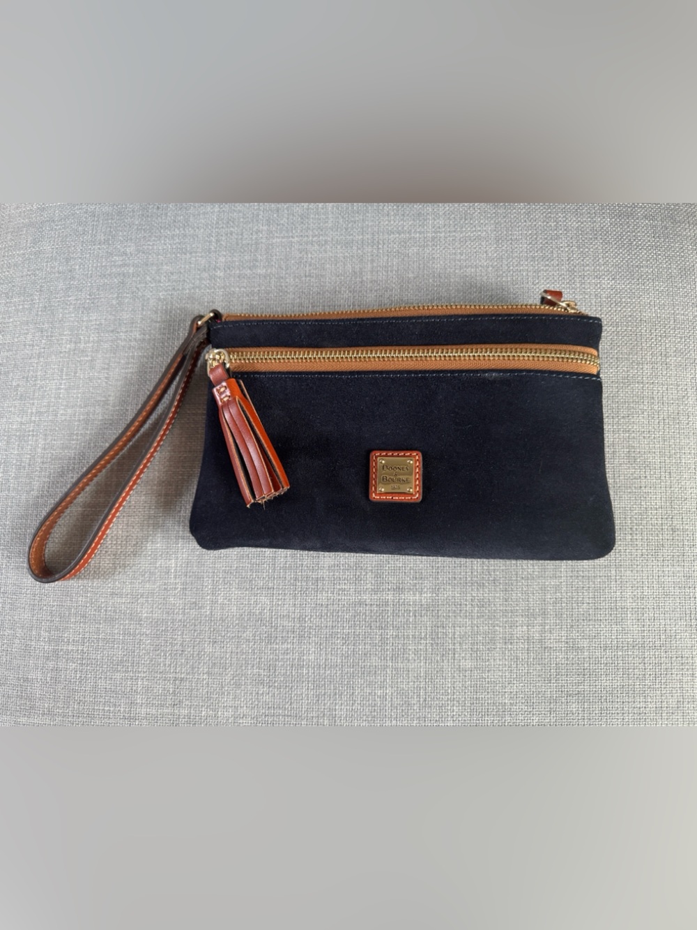Dooney & Bourke Dark Navy Wristlet with Bright Red Interior